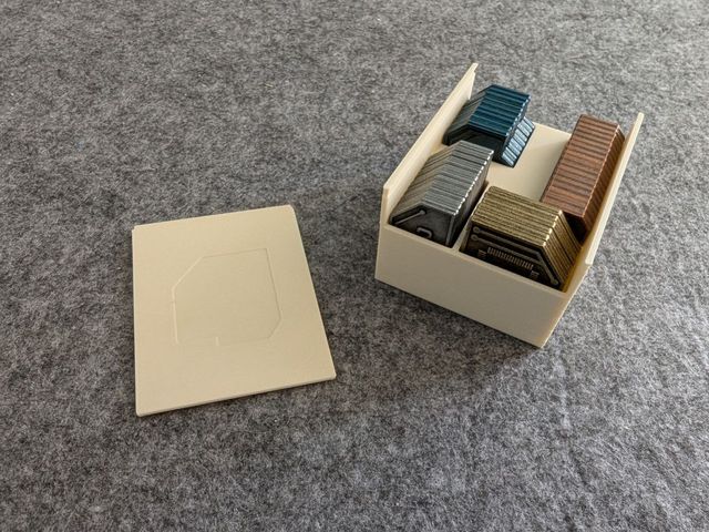 Vantage coin holder with sliding lid, filled with coins